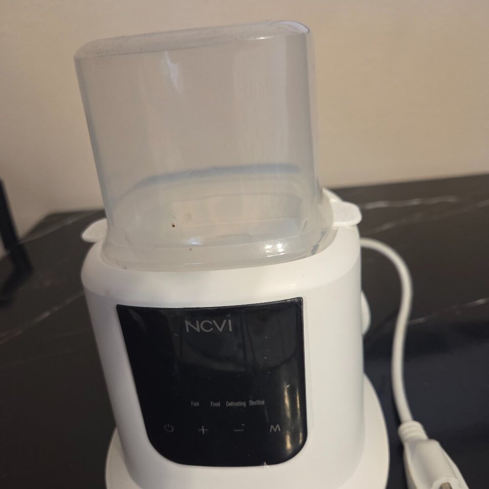 NCVI baby milk warmer